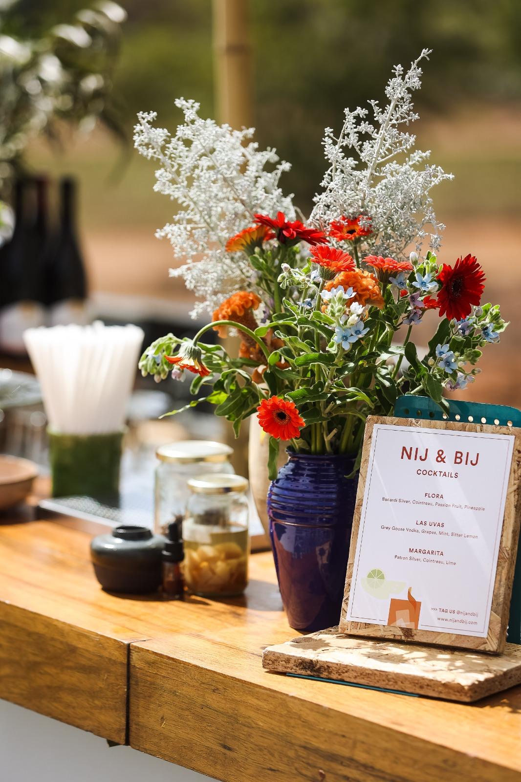 NIJ & BIJ bar menu at an outdoor event