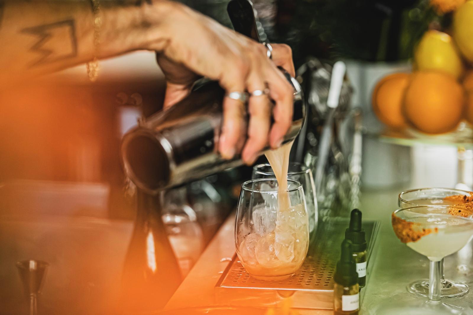 Bartender pouring a cocktail